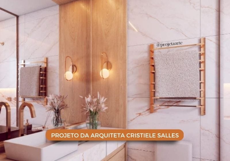 banheiro elaborado com cores claras e cobre