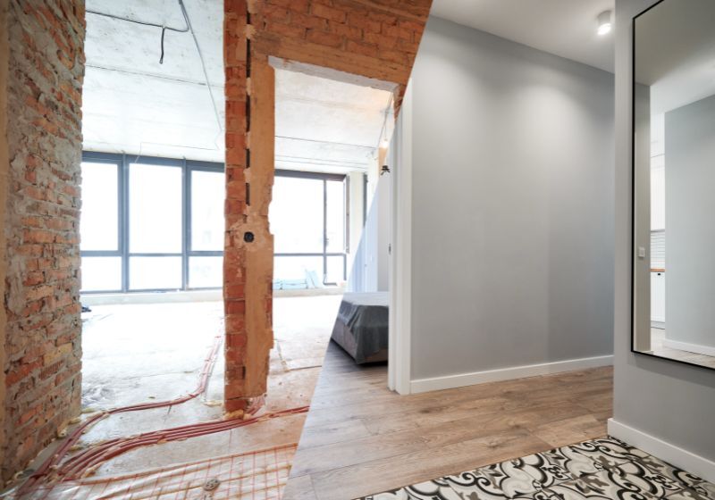 Ambiente em reforma com paredes expostas e piso clean.